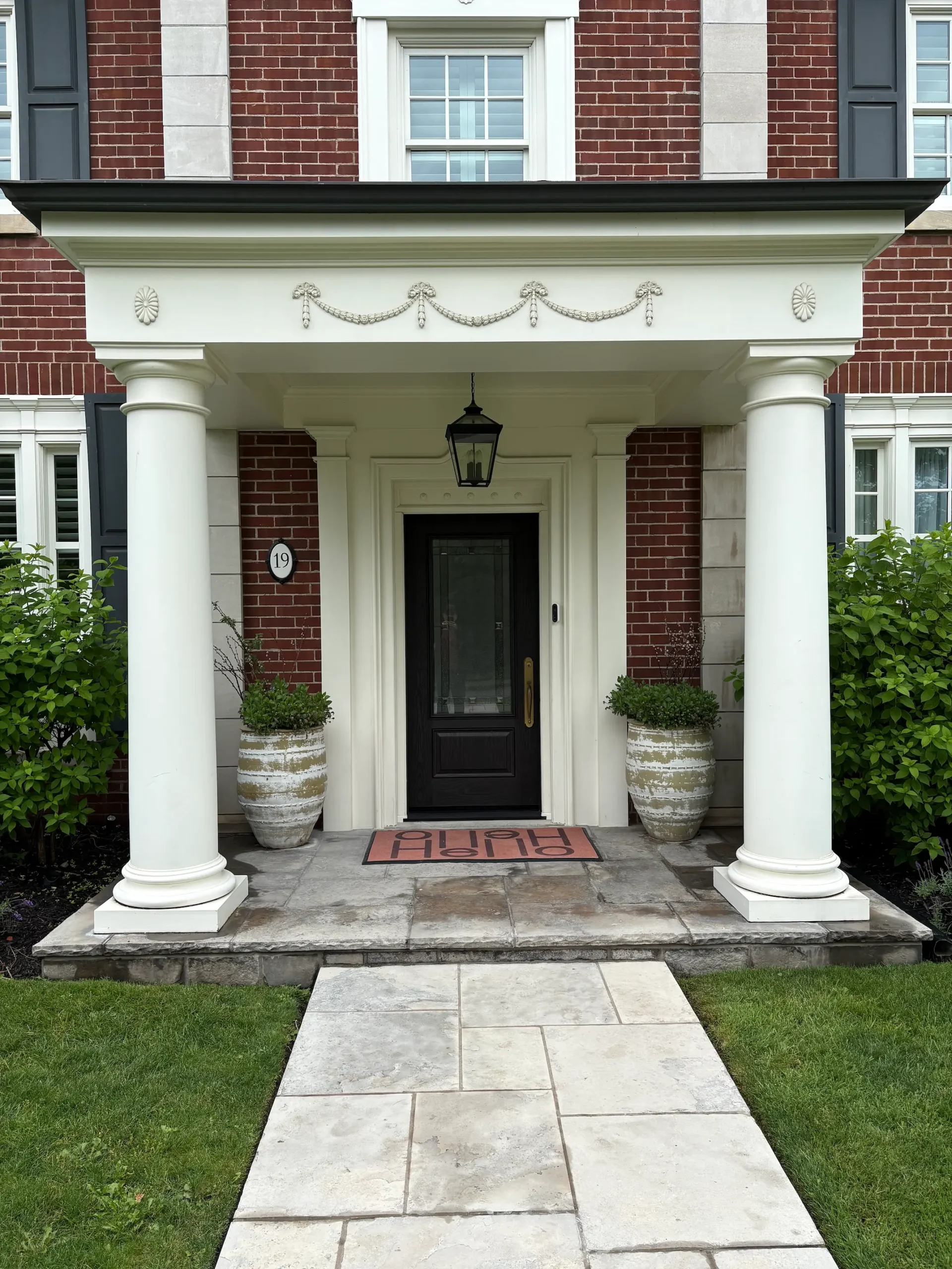 Coffee Bean fibreglass entry door installed by Great Northern Home Exteriors