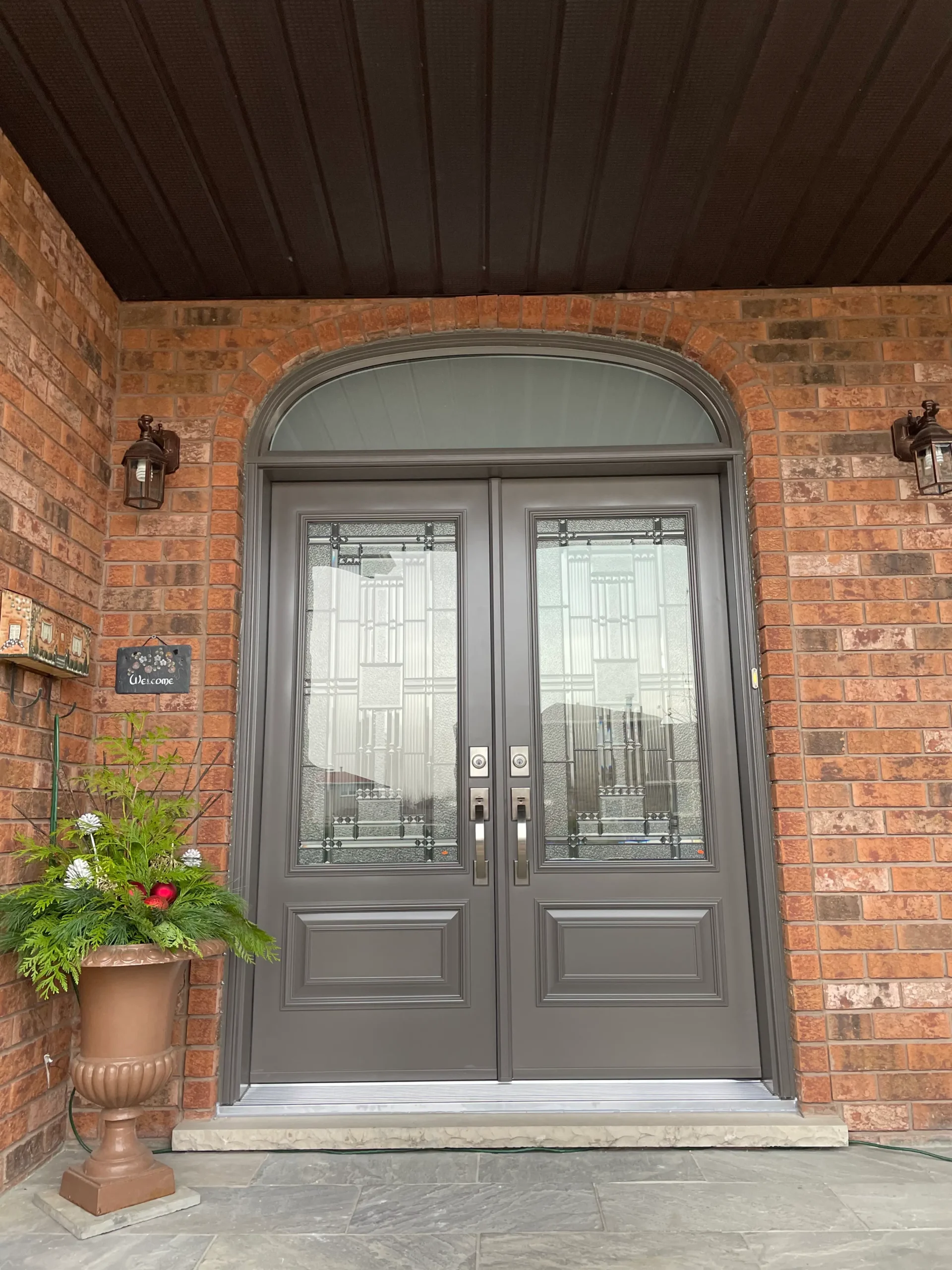 Finished entry door with transom and exterior capping