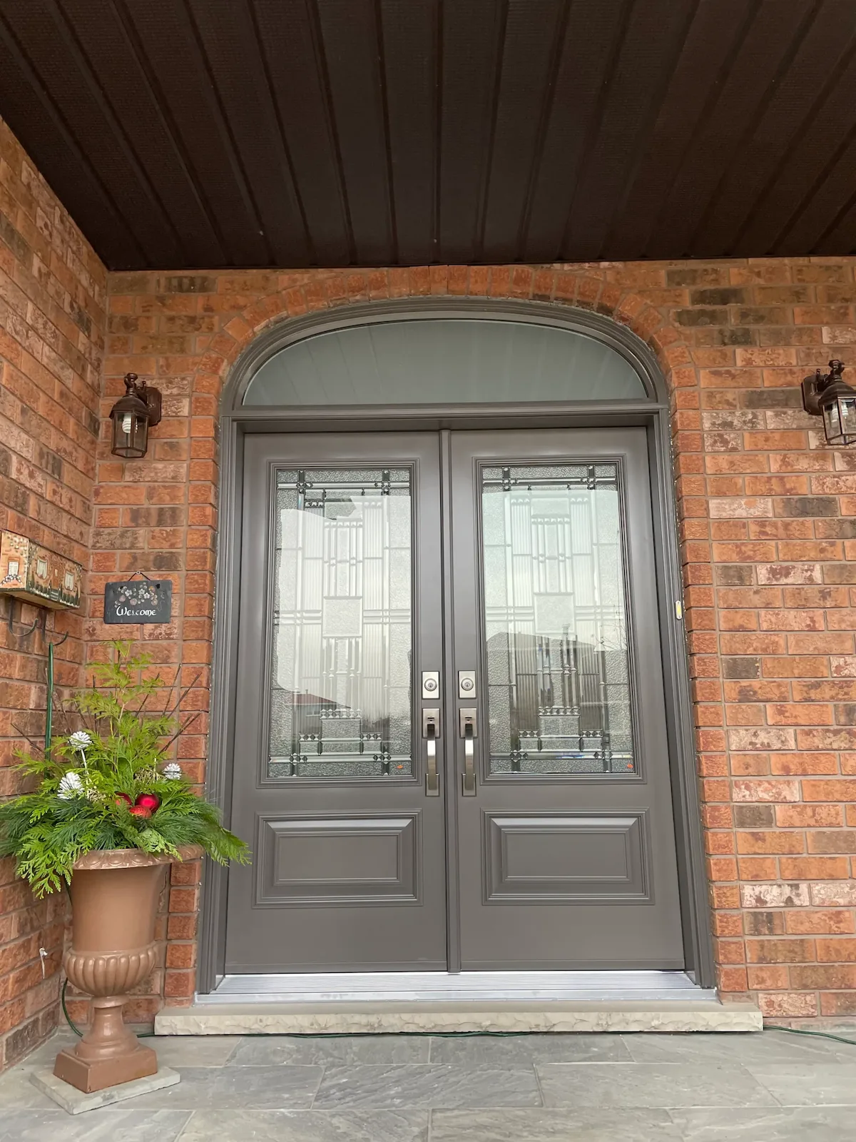 Double entry doors with transom installed by Great Northern Home Exteriors