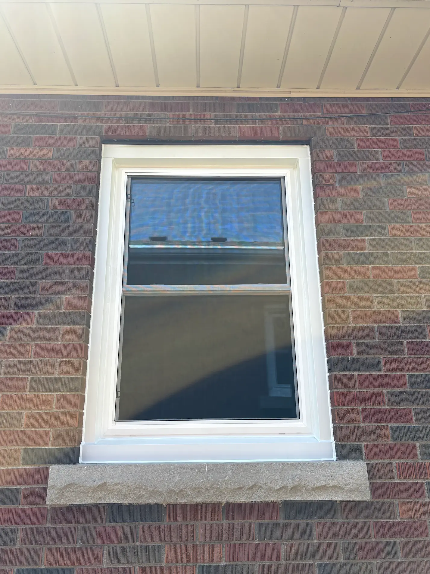 Double-hung replacement window installed in Port Colborne by Great Northern Home Exteriors