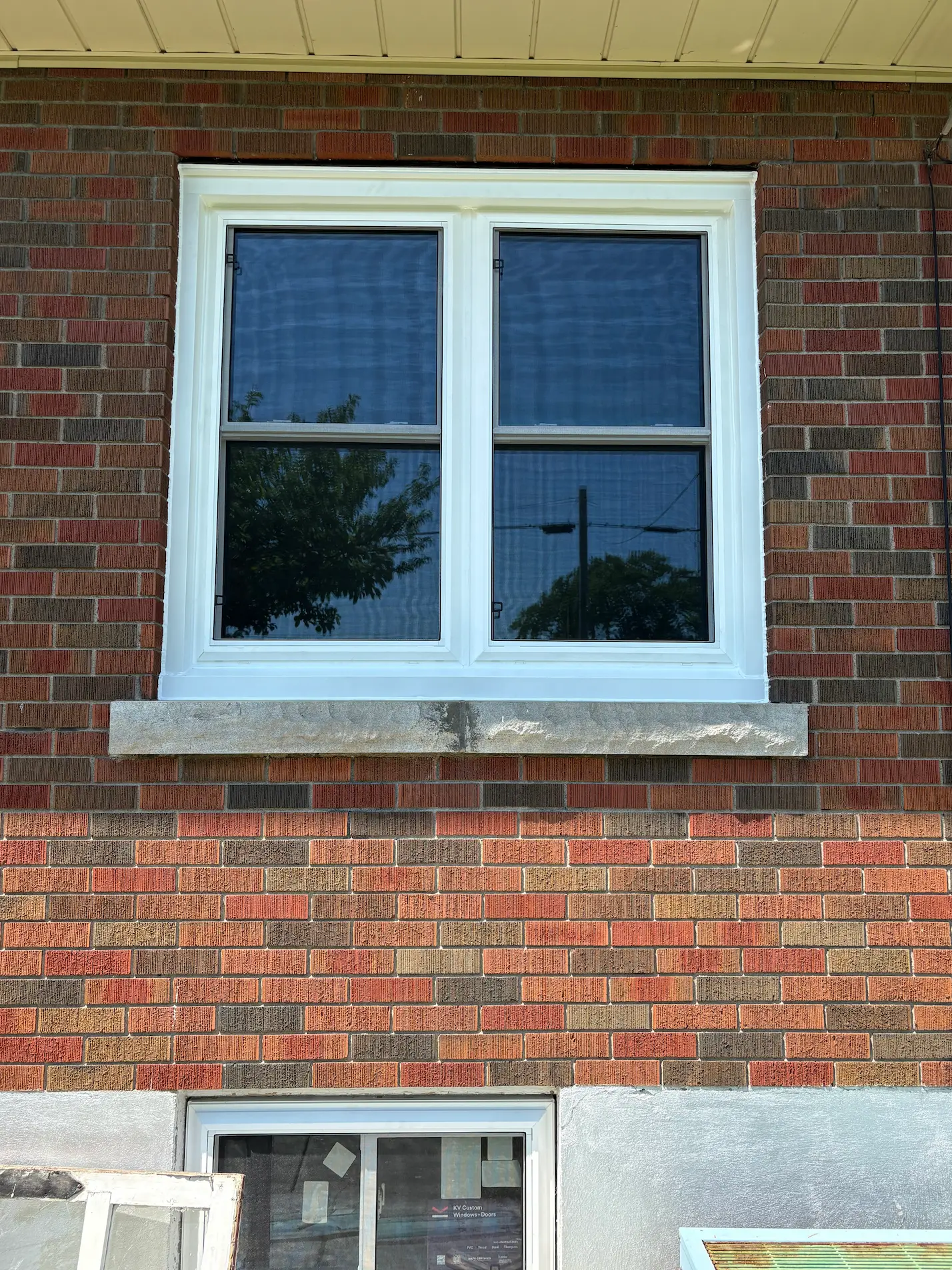 Side-by-side double-hung replacement windows installed in Port Colborne by Great Northern Home Exteriors