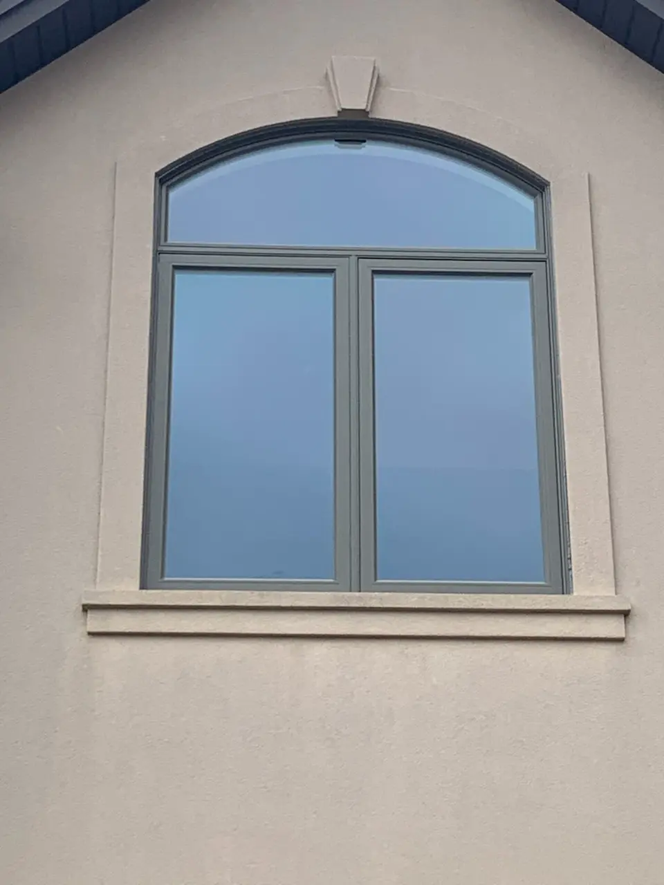 Arched casement window installation by Great Northern Home Exteriors