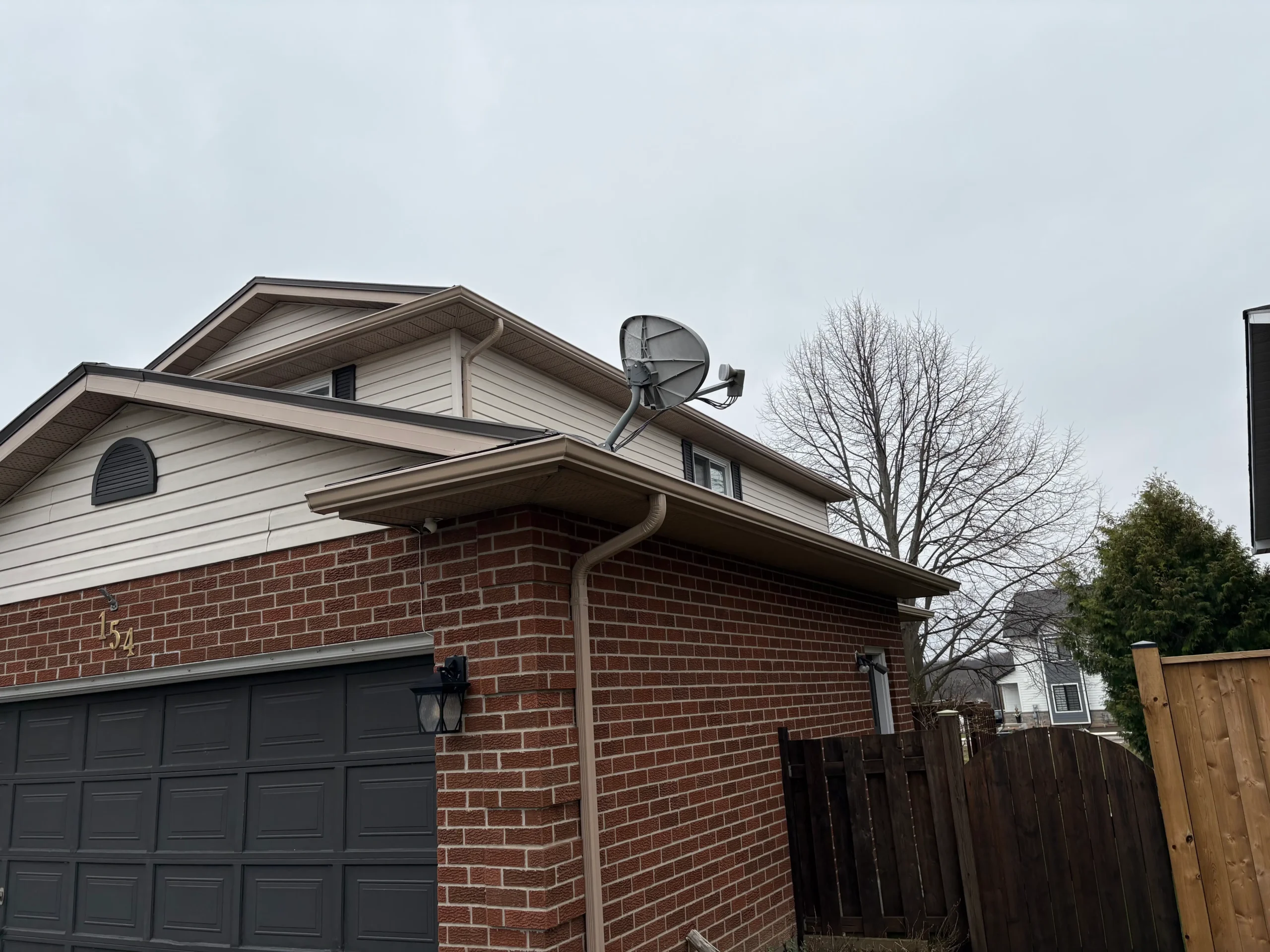 Sandalwood eavestrough installation with clean exterior finish