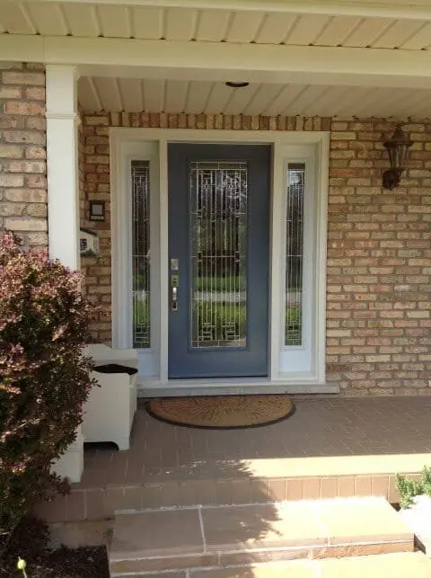 Steel entry door with two sidelites installed by Great Northern Home Exteriors