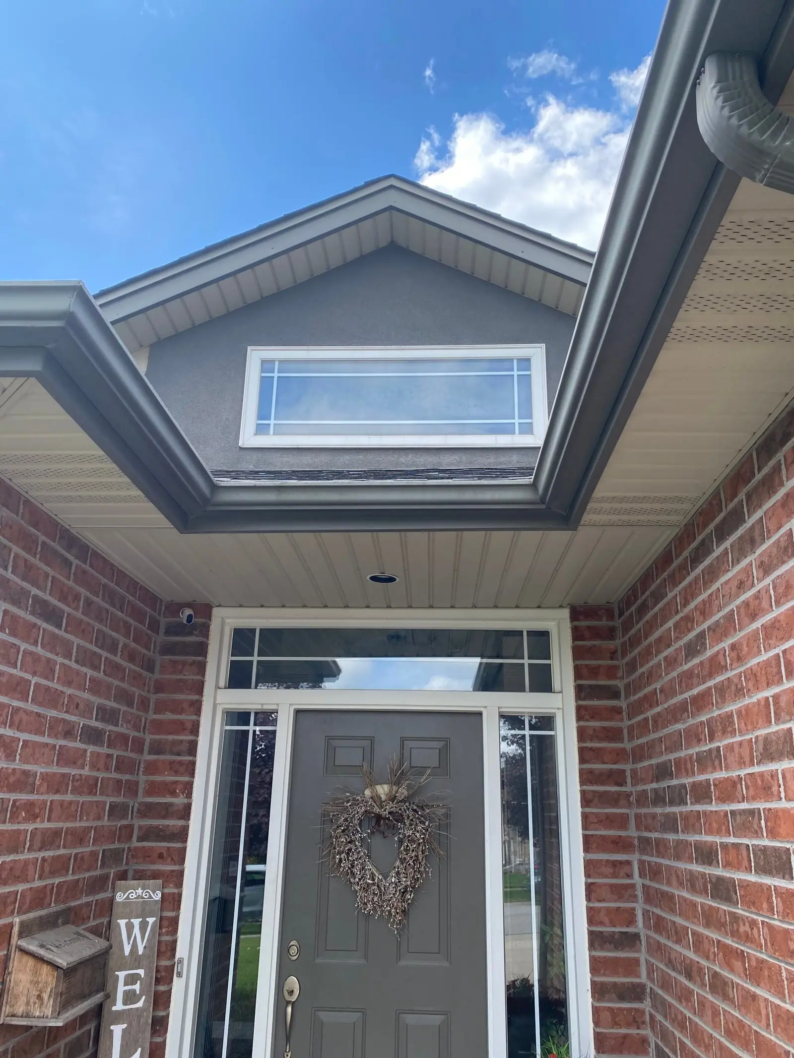 Before entry door with two sidelites