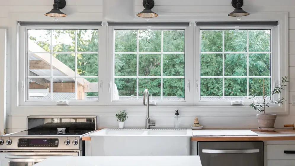 Three awning windows combined into a large picture window installation by Great Northern Home Exteriors
