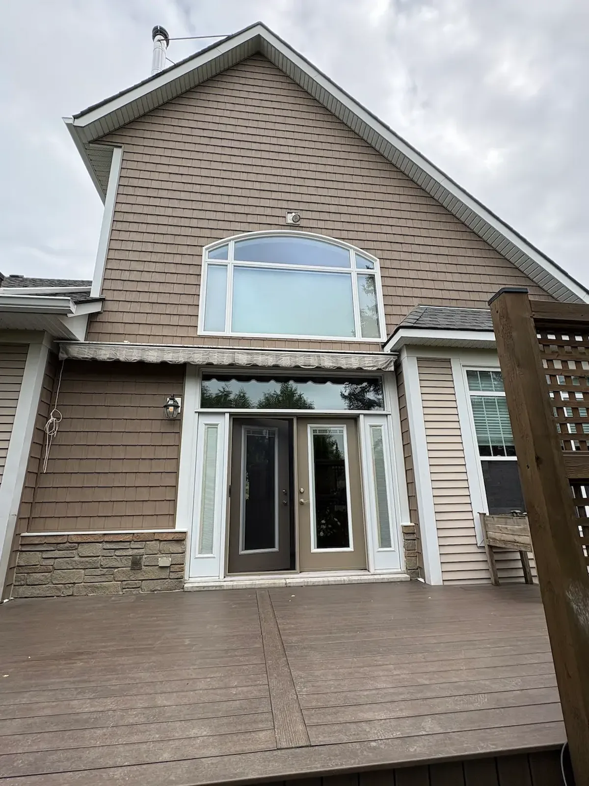 Vinyl shake siding installed on a home exterior