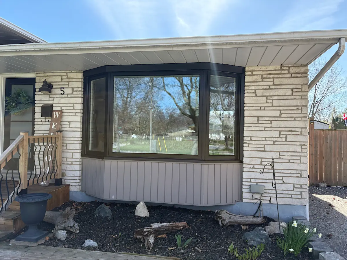 Black bay window installation by Great Northern Home Exteriors in Niagara Falls