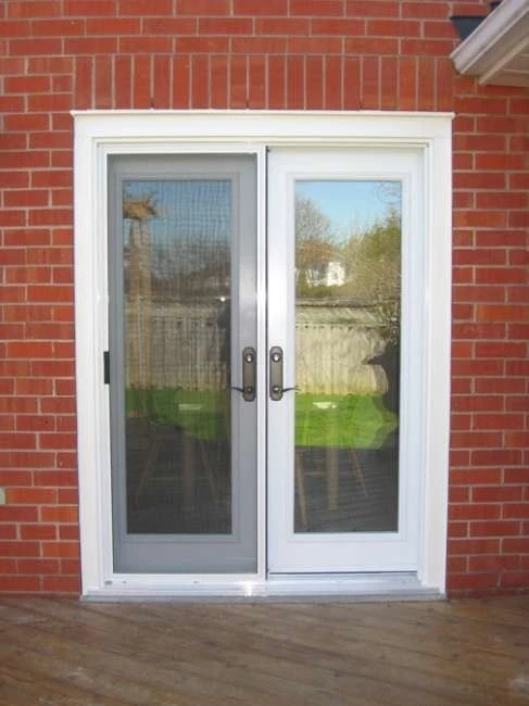 Garden-style patio door with full glass and white frame installed by Great Northern Home Exteriors on a home in Fort Erie.