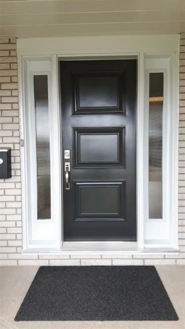 Black executive-style entry door with white sidelites installed in Niagara Falls by Great Northern Home Exteriors.