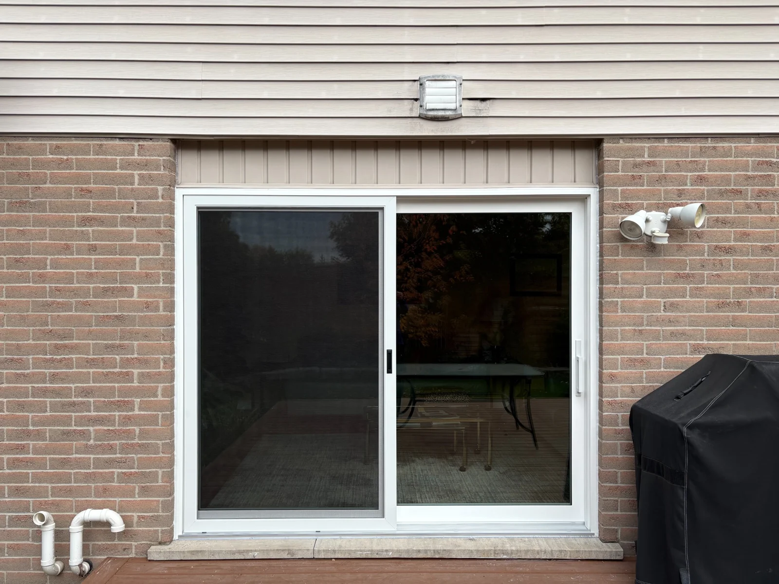 Patio door installation by Great Northern Home Exteriors with clean trim and smooth sliding operation